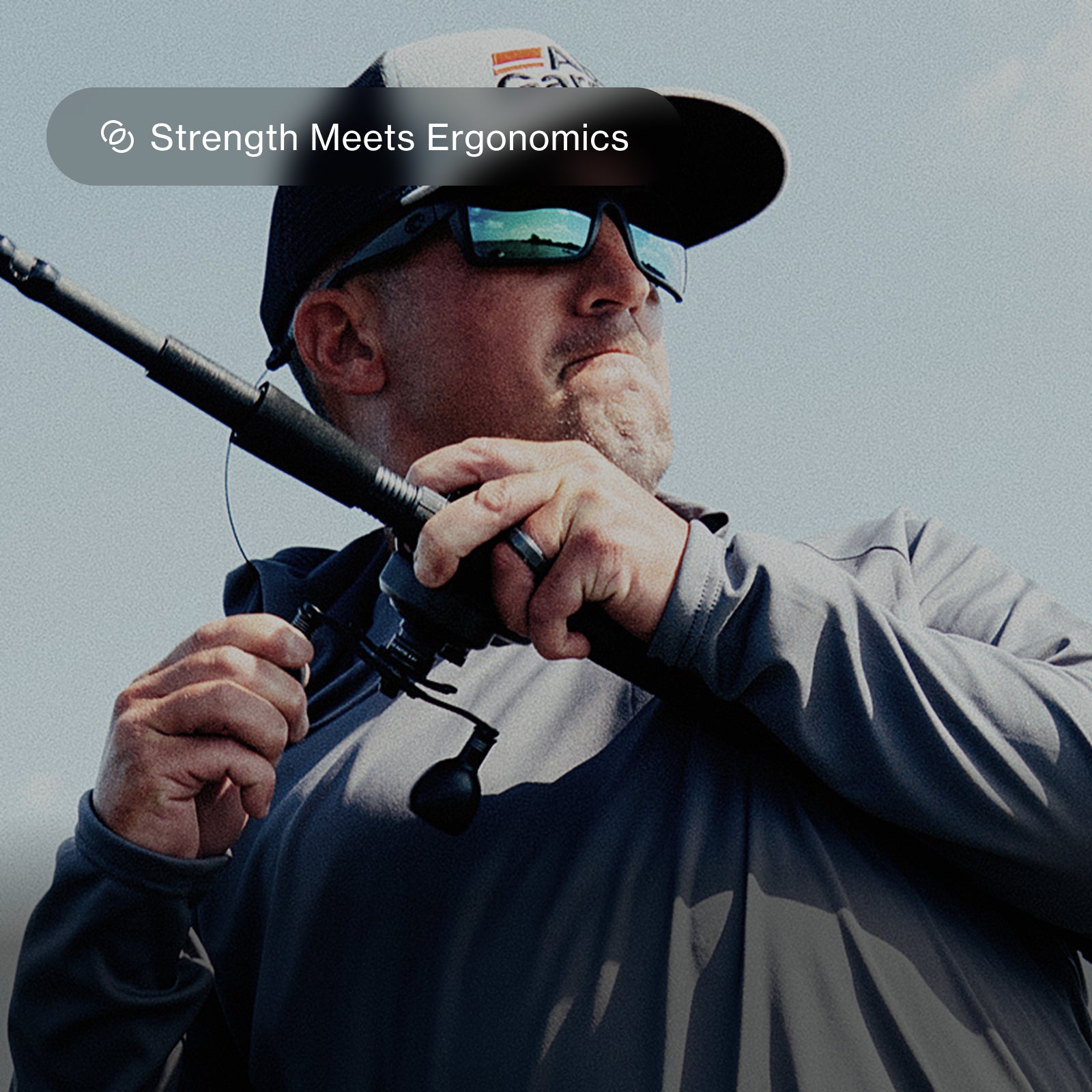 Man reeling in large fish